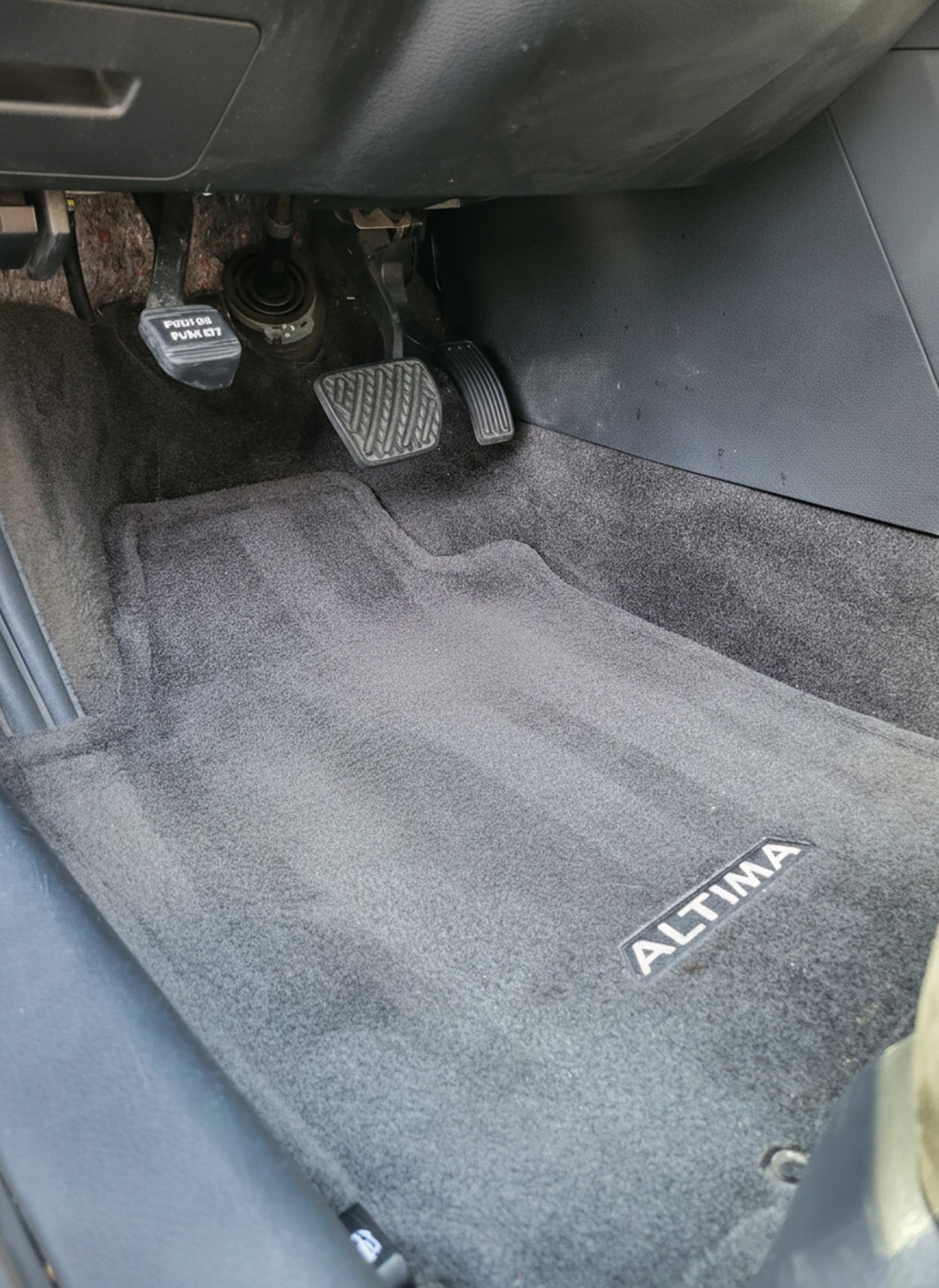 Clean driver-side floor mat and pedals after detailing